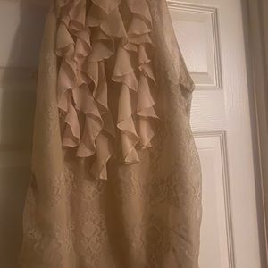 blouse size medium champagne color with ruffles.